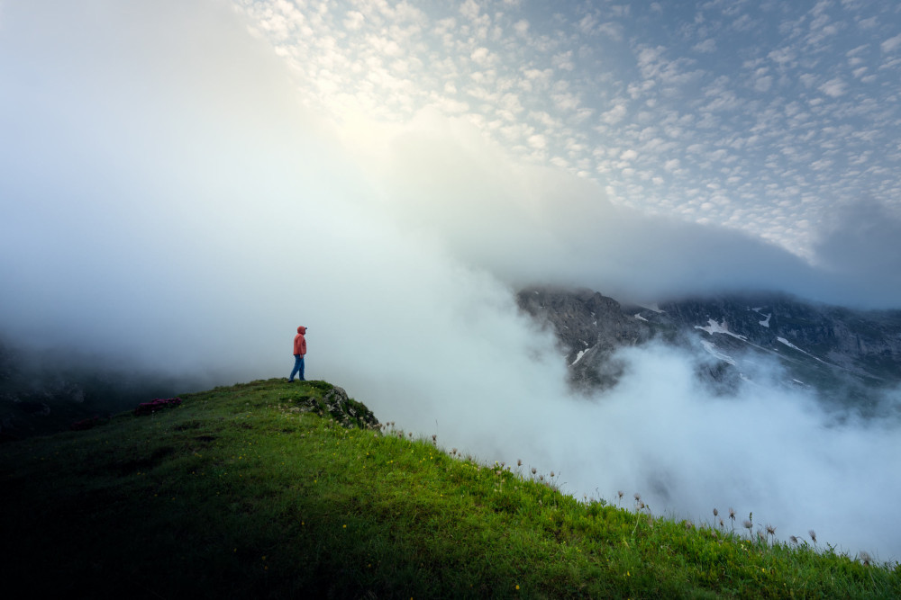 Man and misty morning in Dolomites...